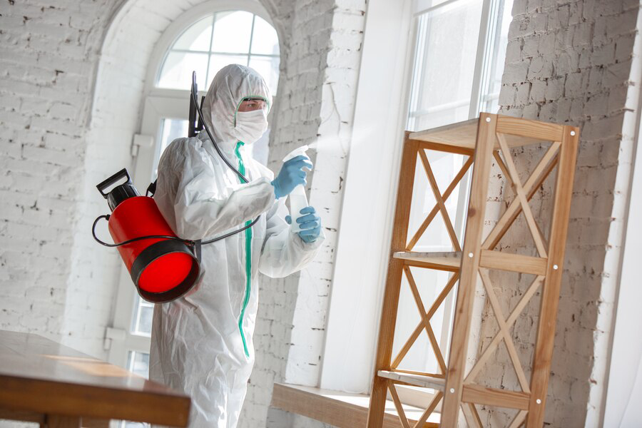 coronavirus-pandemic-disinfectant-protective-suit-mask-sprays-disinfectants-room_155003-4351
