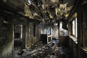 inside-shot-abandoned-destroyed-building-with-burned-walls-worn-out-doors_